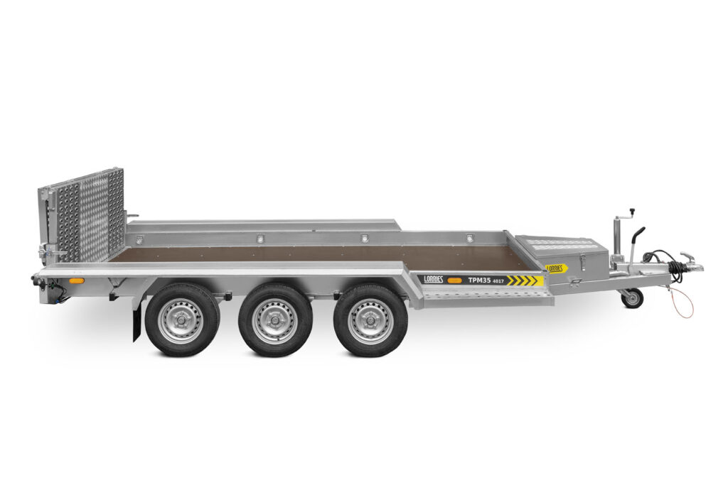 three-axle construction trailer with a foldable ramp