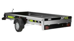 The silver-colored STX375o outboard trailer has black wheel fenders, a single axle, STX and LOARIS logos, yellow and green reflective stripes, and tail lights.